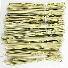 Multiple tied bundles of dried darbha (kusha) grass used in Hindu rituals and spiritual practices.